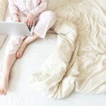 high-angle-view-woman-lying-bed-min